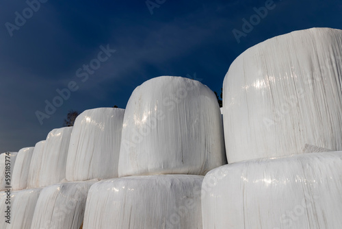 Obraz na płótnie plastic packaging on mown hay for long-term storage