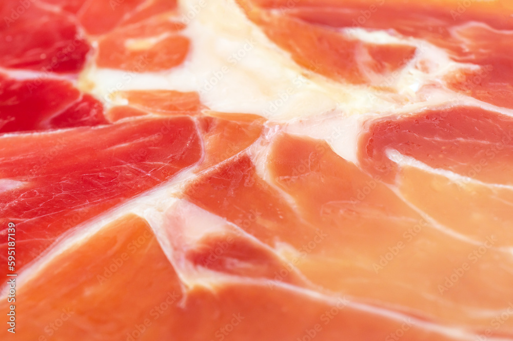 Texture of fresh jamon piece. Close up. Texture of fresh jamon piece. Close up.