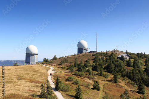 Mountain Großer Arber panorama with radar domes (radome) and summit cross and in Bavarian Forest, Germany