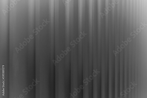 Ribbed gray wall panel. Repair, construction and modern finishing materials in interior design. Front view. Background. Space for text.
