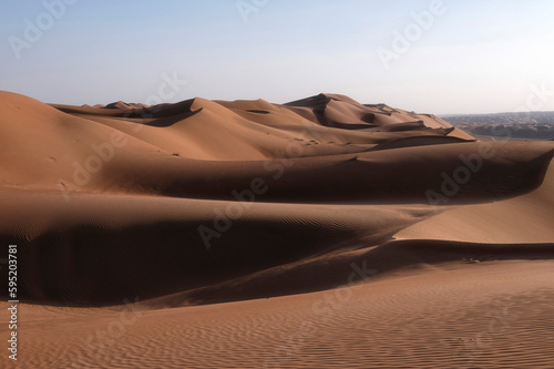 Sunset over sand dunes of Oman