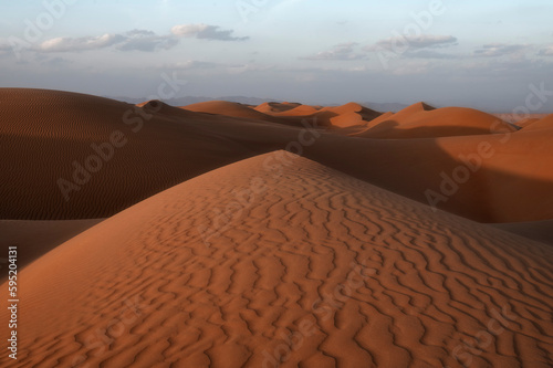 Sunset on ripples on Sand Dunes of Wahiba Sands Desert, Oman