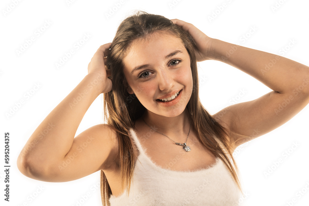 Beautiful smiley girl touching her hair isolated on white background and smiling Beautiful smiley girl touching her hair isolated on white background and smiling
