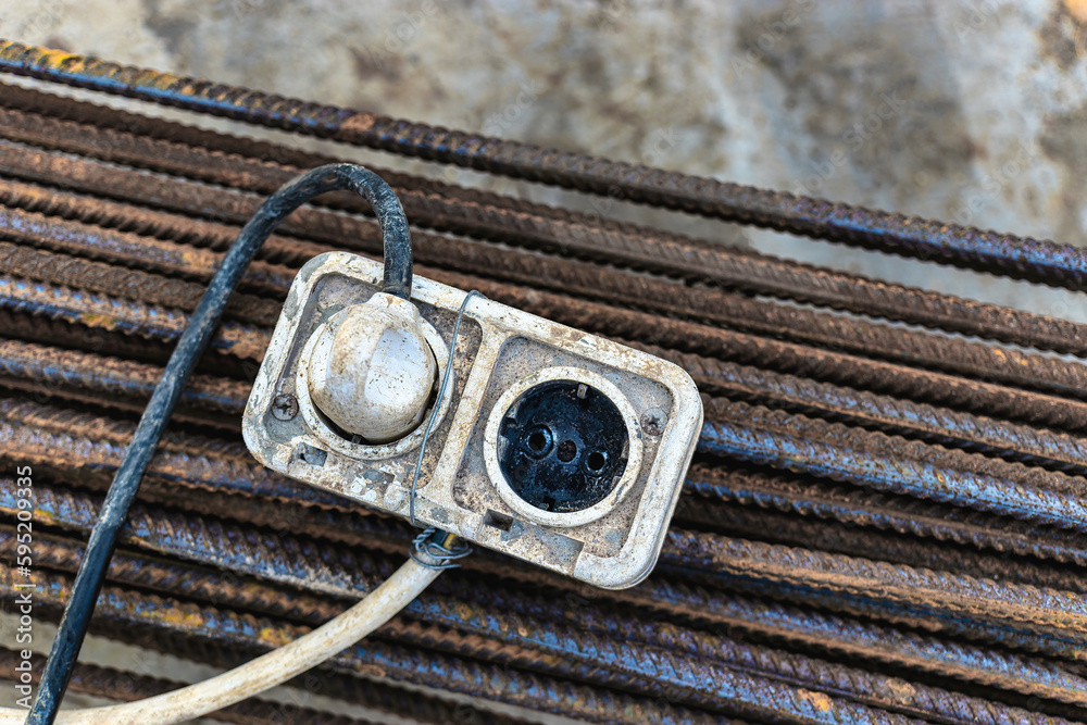 The extension power strip, power cord old and damaged on the