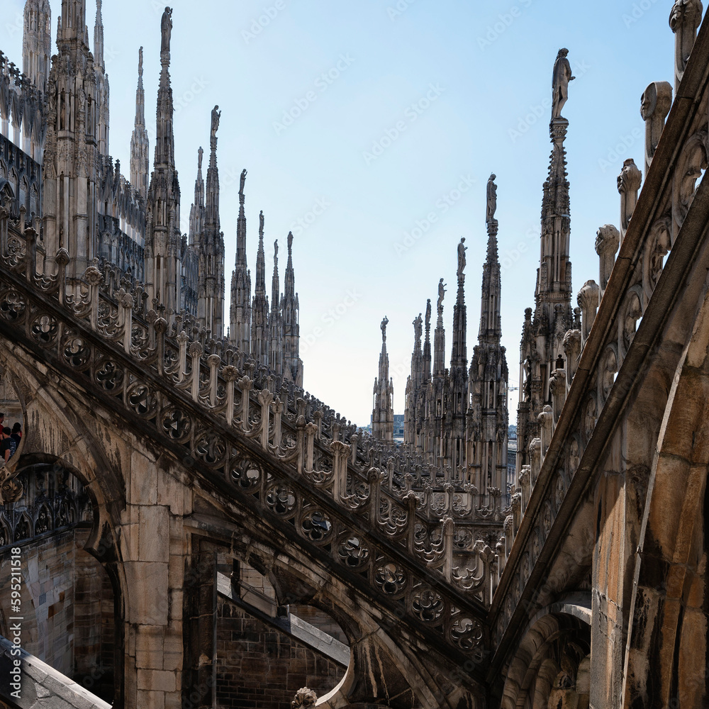 Rooftop of Duomo di Milano or Milan Cathedral with spires and statues