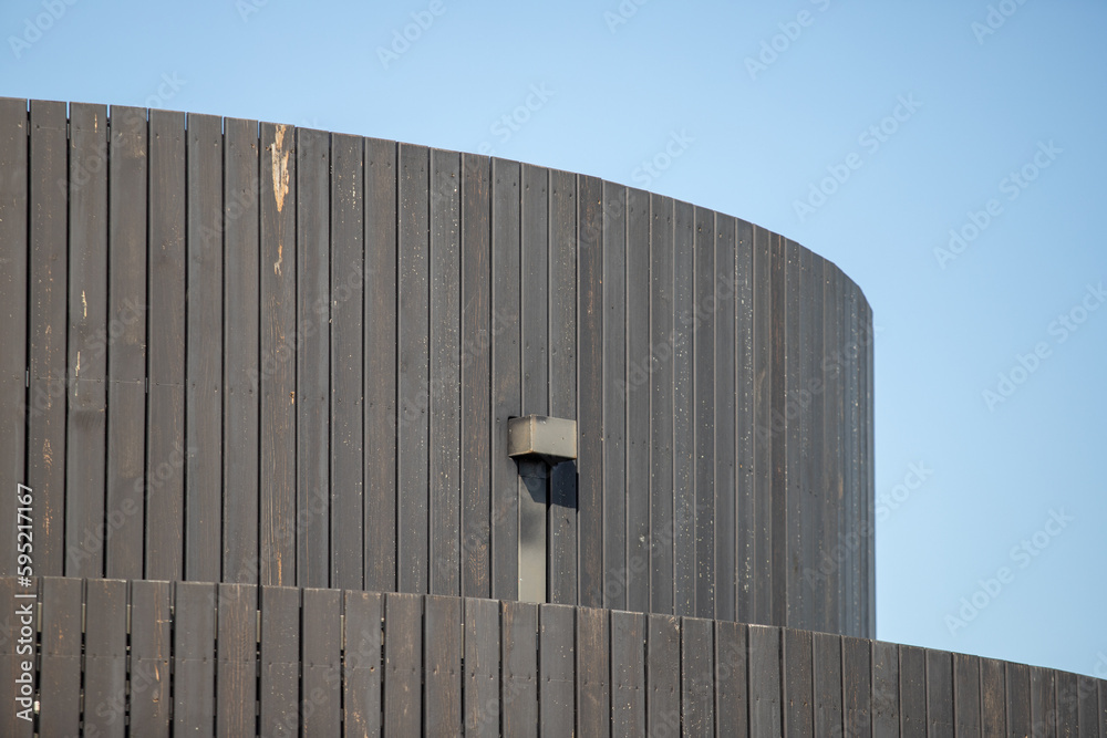house with a wooden roof in the village against the blue sky house with a wooden roof in the village against the blue sky