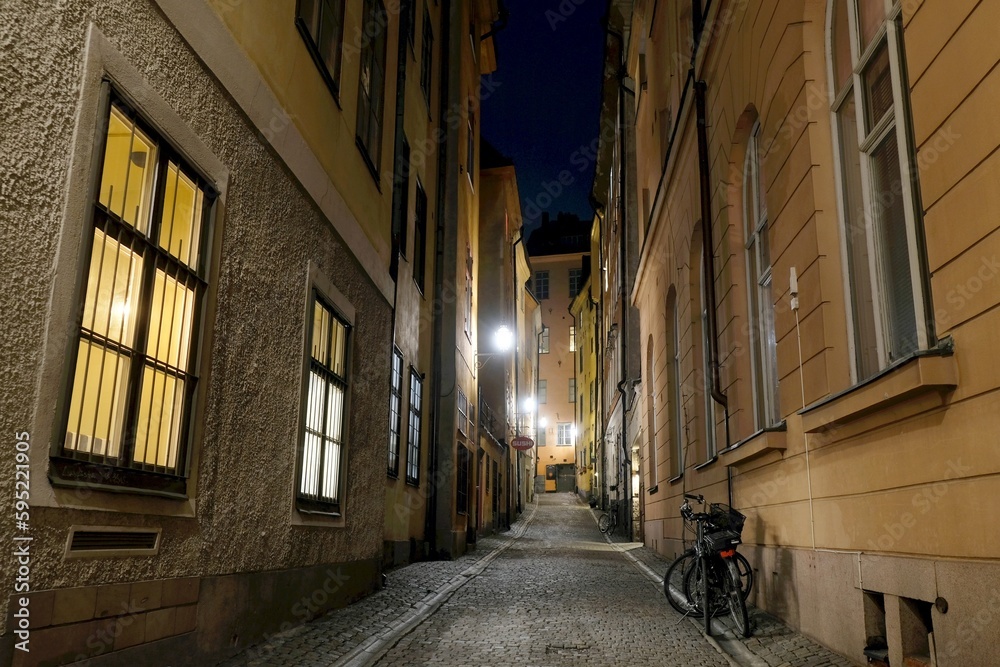 Beautiful scenery of illuminated Stockholm by night. Narrow street on Gamla Stan. Sweden