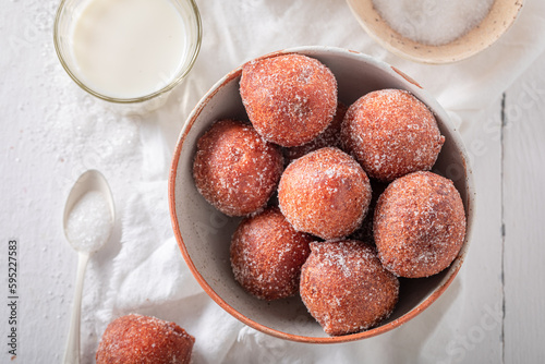 Hot mini doughnuts as a tasty snack.