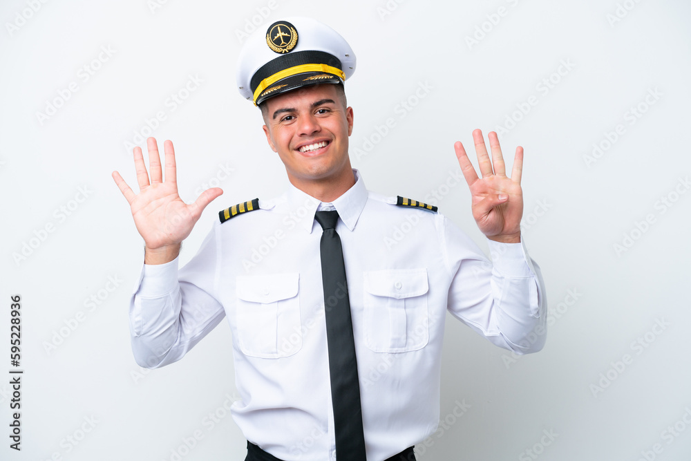 Airplane pilot caucasian man isolated on white background counting nine with fingers Airplane pilot caucasian man isolated on white background counting nine with fingers