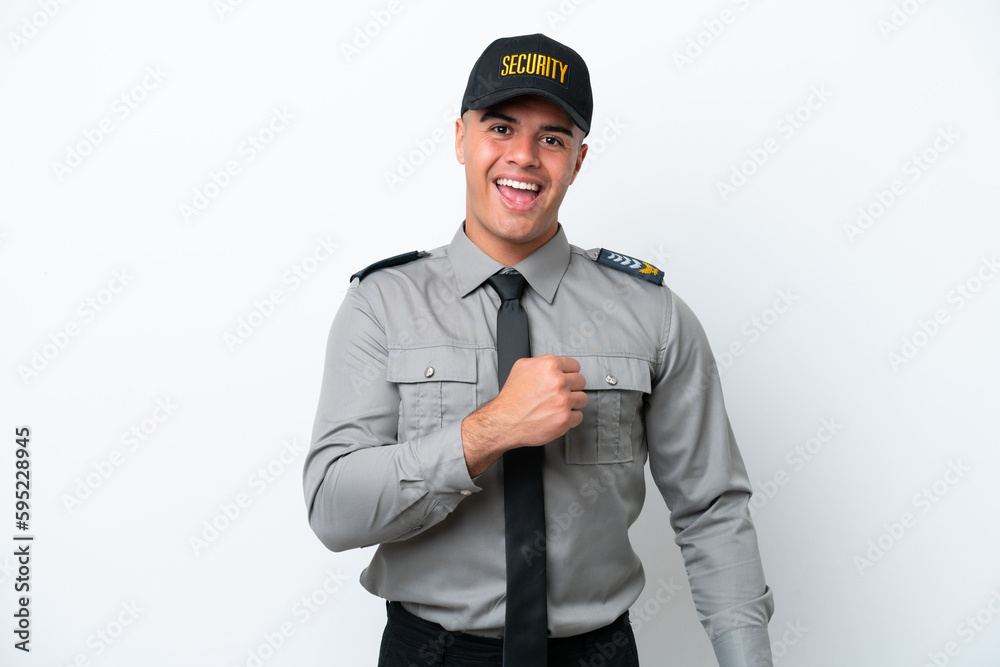 Young caucasian security man isolated on white background celebrating a victory