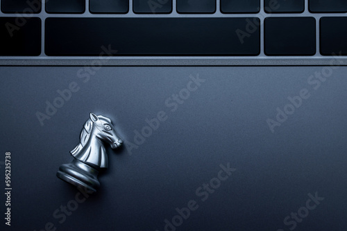 Silver chess on laptop, Marketing or business strategy, Chess battle victory success, Team leader teamwork business strategy, Chess business concept, Leader and success concept.