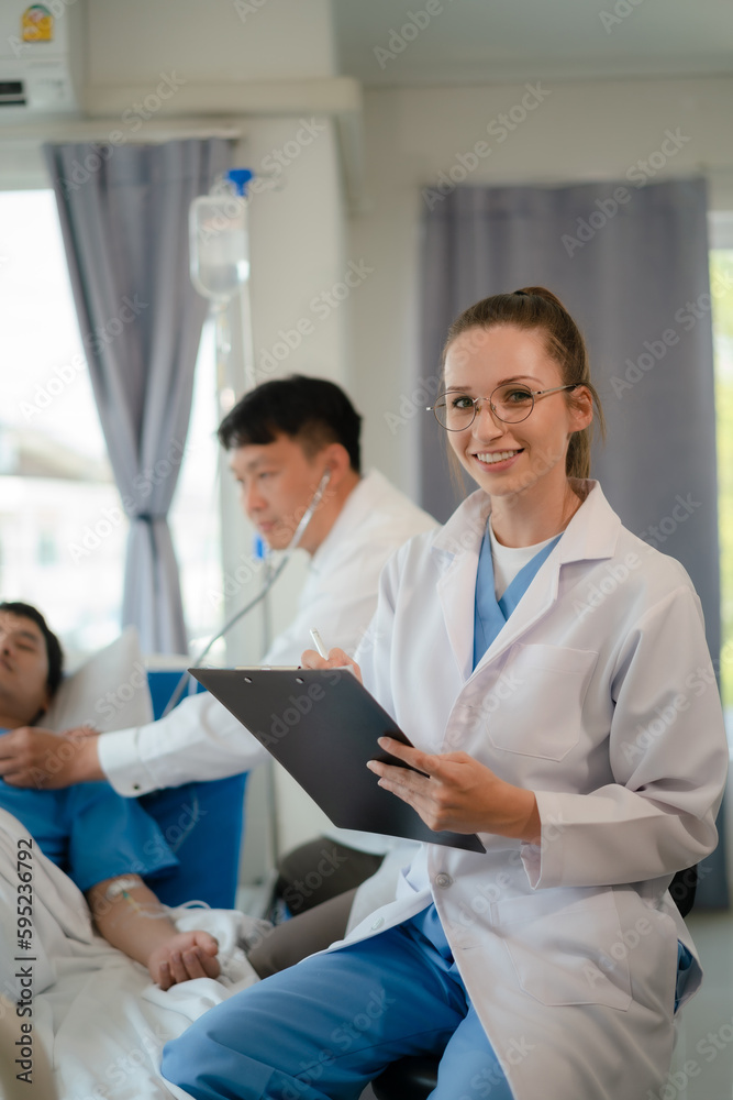doctor team talking with man patient for monitoring and check up after surgery. doctor touching patient hand and consoling. doctor team talking with man patient for monitoring and check up after surgery. doctor touching patient hand and consoling.