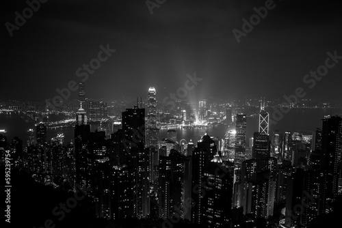 black and white city skyline at night in hong kong island © Carolin