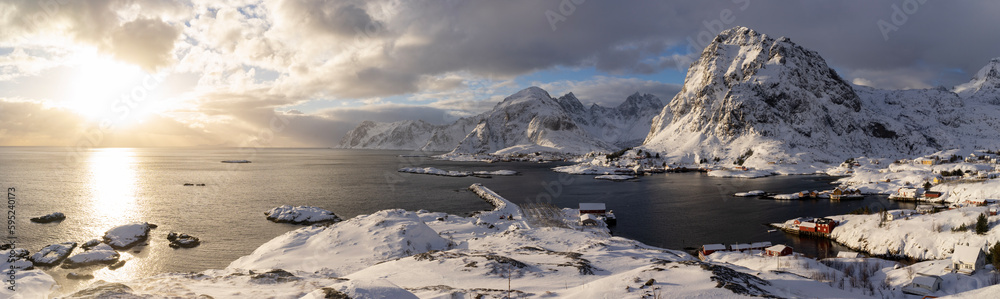 snow covered mountains on northsea in norway