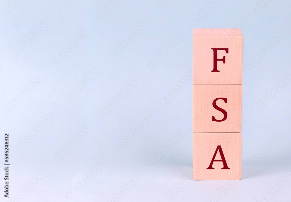 FSA on wooden cubes on a blue background FSA on wooden cubes on a blue background