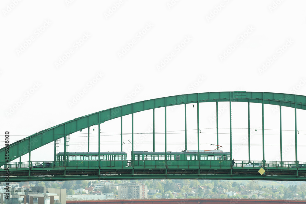 Fototapeta premium Green tram on a green bridge in the city Belgrade