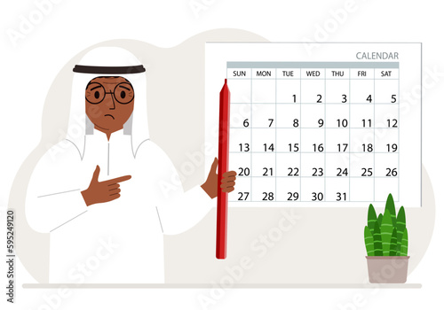 A man with a pencil in his hand creates a calendar. Planning and time management, responsible employee plans meetings and events.
