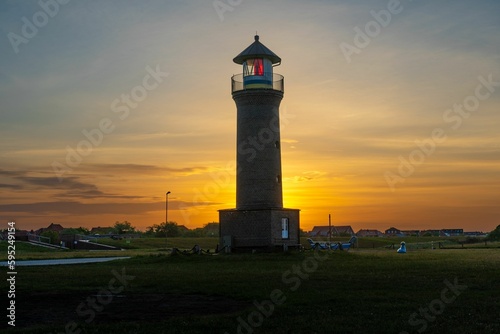 Picturesque lighthouse illuminated by the setting sun