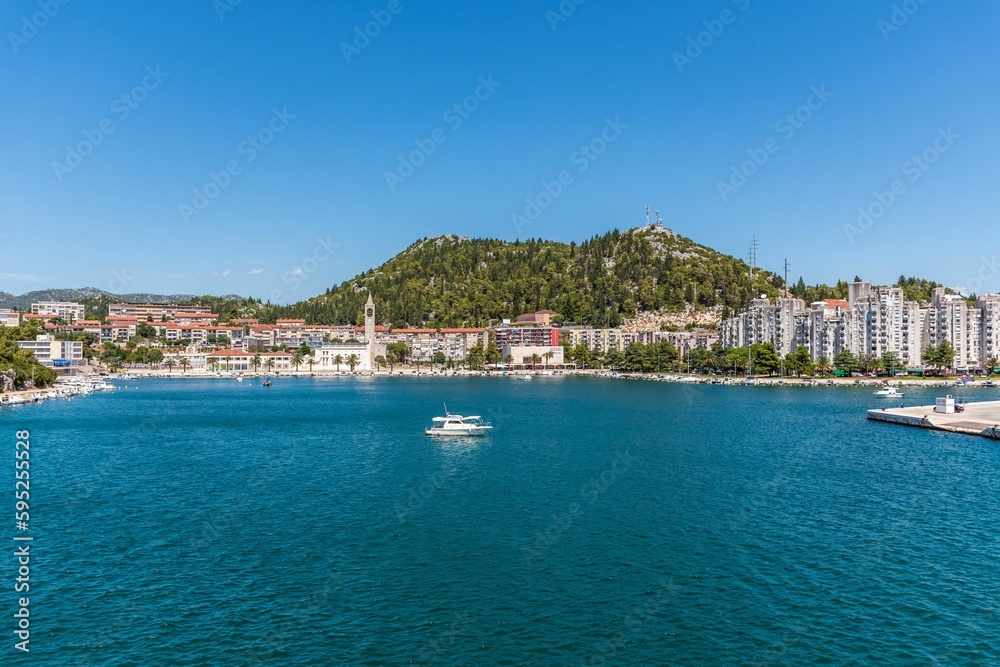 Stunning view of a tranquil bay near a coastal town. Ploce, Croatia. Stunning view of a tranquil bay near a coastal town. Ploce, Croatia.
