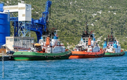 Canvastavla Row of tugboats docked in the port of Ploce in Croatia.