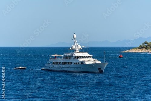 Luxury yacht sailing near the Peljesac peninsula on the coast of the Adriatic sea. Croatia. © Marko Klarić/Wirestock Creators