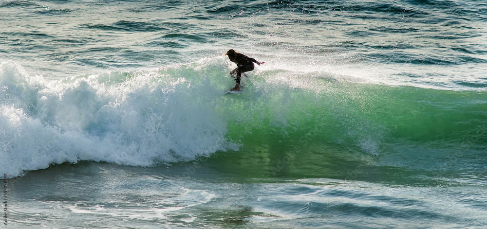 Surfer battling the swell in the southwest of France