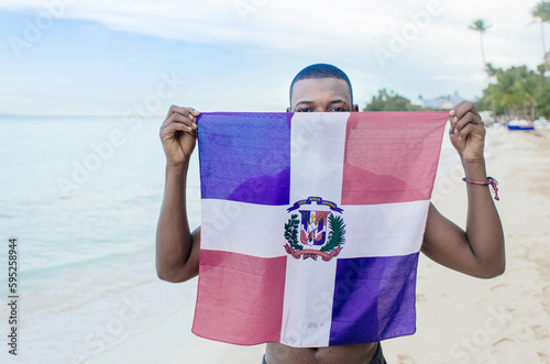Dominican flag beach boy hiding face