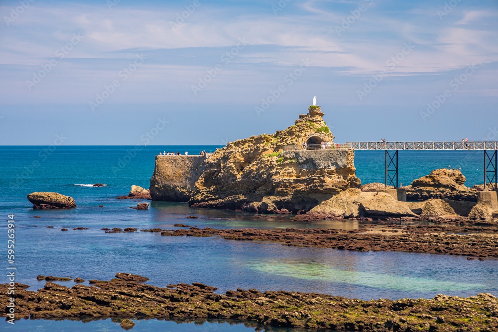 Rocher de la Vierge rock in Biarritz at low tide in France