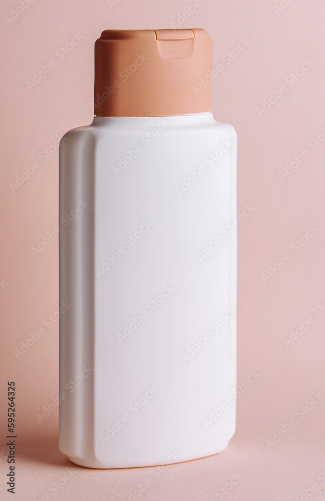 cosmetic bottle on brown background cosmetic bottle on brown background