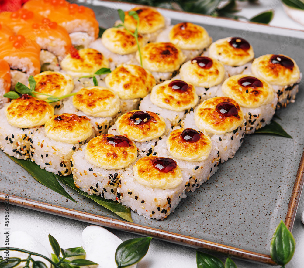 different sushi rolls on a big plate different sushi rolls on a big plate