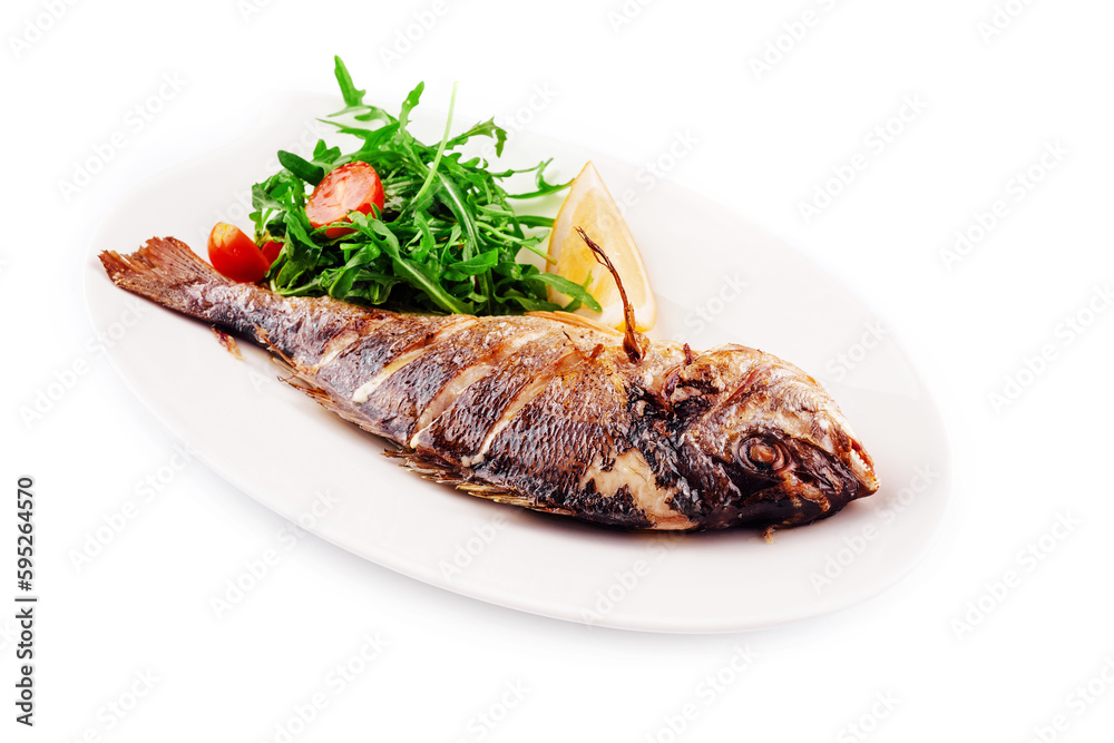 Baked sea bream fish with arugula salad and tomatoes
