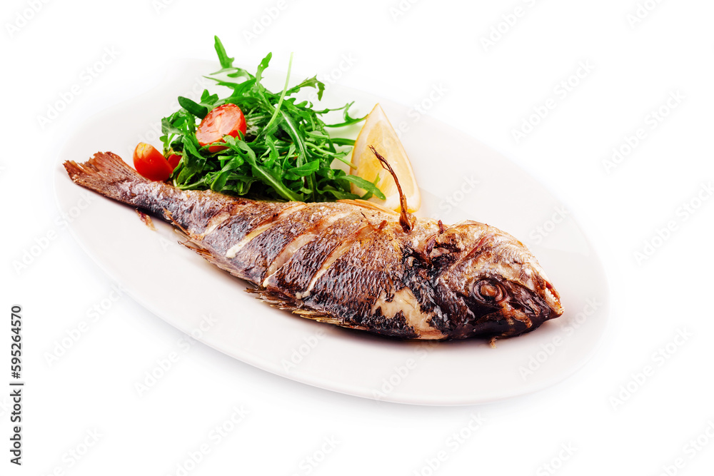 Baked sea bream fish with arugula salad and tomatoes Baked sea bream fish with arugula salad and tomatoes