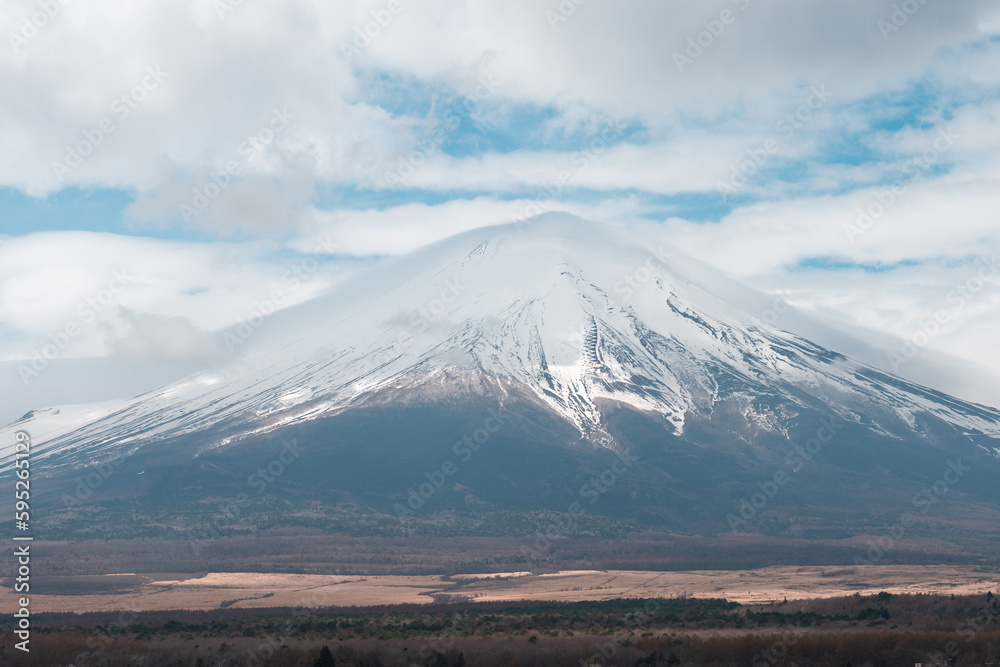 Scenic view of snowcapped mountain Fuji against sky at Yamanaka lake
