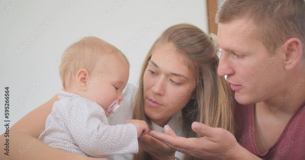 Parents interacting with their newborn baby Parents interacting with their newborn baby