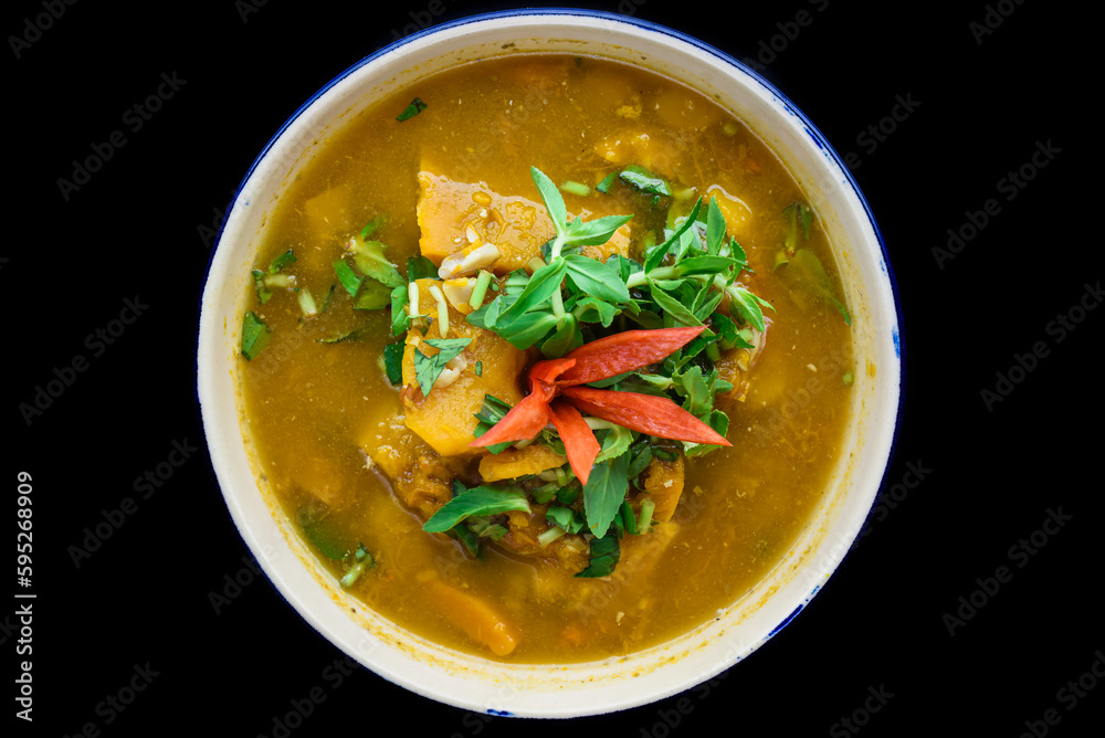 Vietnamese pumpkin Soup on black background Vietnamese pumpkin Soup on black background