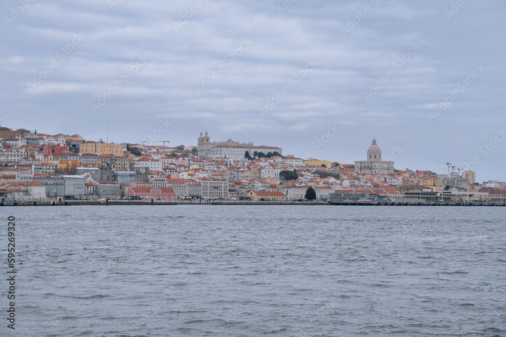 View of the Alfama district in Lisbon from the Tagus River (Portugal). 