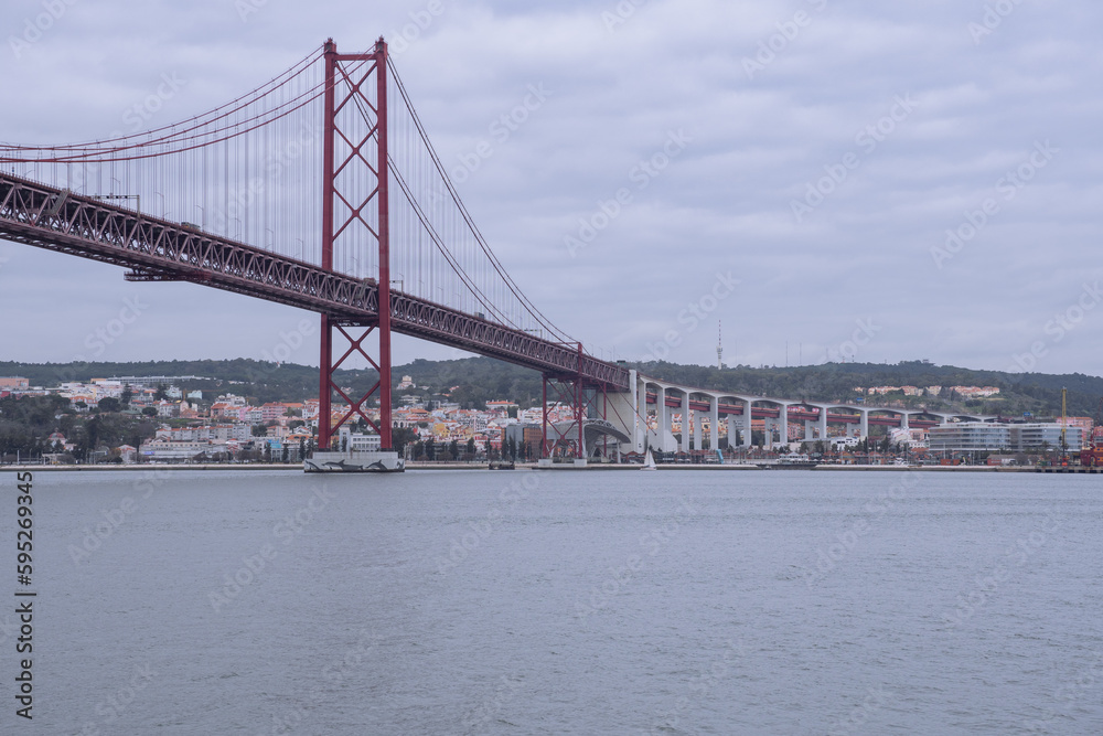 View of the 25 April bridge from the Tagus river in Lisbon (Portugal). Europe's longest bridge connecting the city of Lisbon. View of the 25 April bridge from the Tagus river in Lisbon (Portugal). Europe's longest bridge connecting the city of Lisbon.