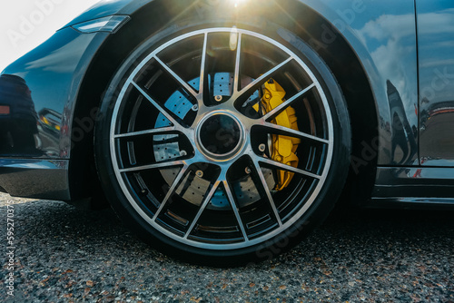 Alloy wheel Skill Forged with calipers and racing brakes Wilwood of sport car. Racing brake disc and low profile tyres. Tires of race car, drag and drift cars