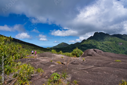 Copolia trail, couple heading back down the nature trail,view of morn blanc an morn Seychellois photo