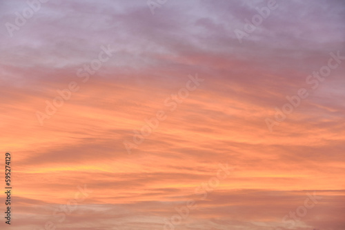 Sky light after sunset. orange background, clouds