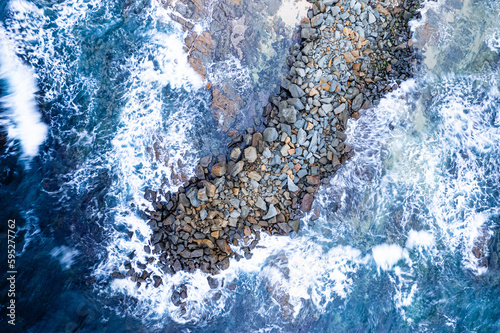 Waves crashing on stormy day at the Apollo Bay Ocean Breakwater, Drone Photograph photo