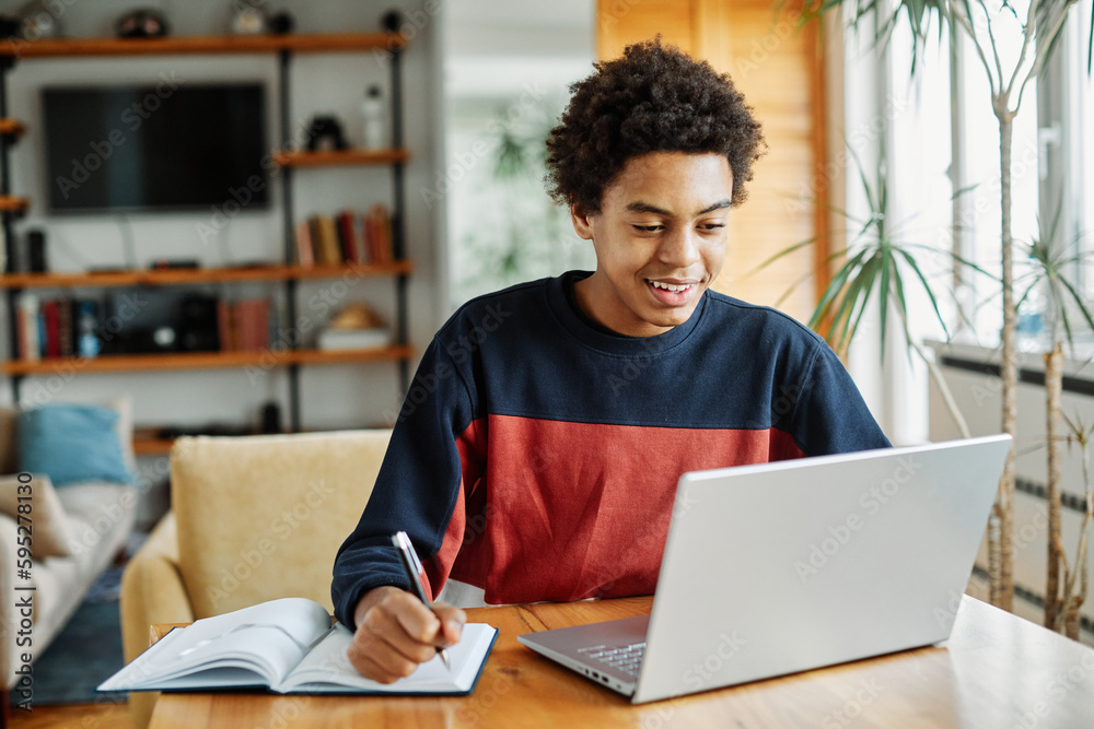 education laptop student computer teenager studying boy learning homework  study young school teenage black technology happy internet sitting college  online man notebook using Stock Photo | Adobe Stock