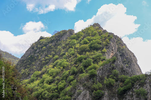 Beautiful landscape photographs of mountains with a bright blue sky.