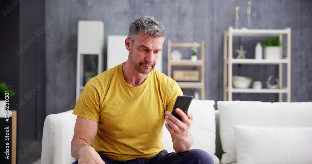 Scam Text Message. Frustrated Confused Man Scam Text Message. Frustrated Confused Man