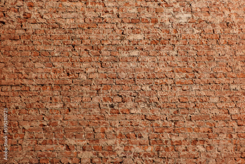 Old red brick wall without plaster