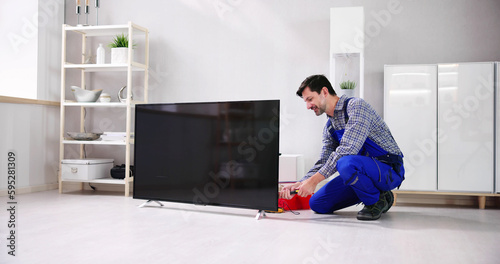 Electrician Repairing Television Or TV Appliance