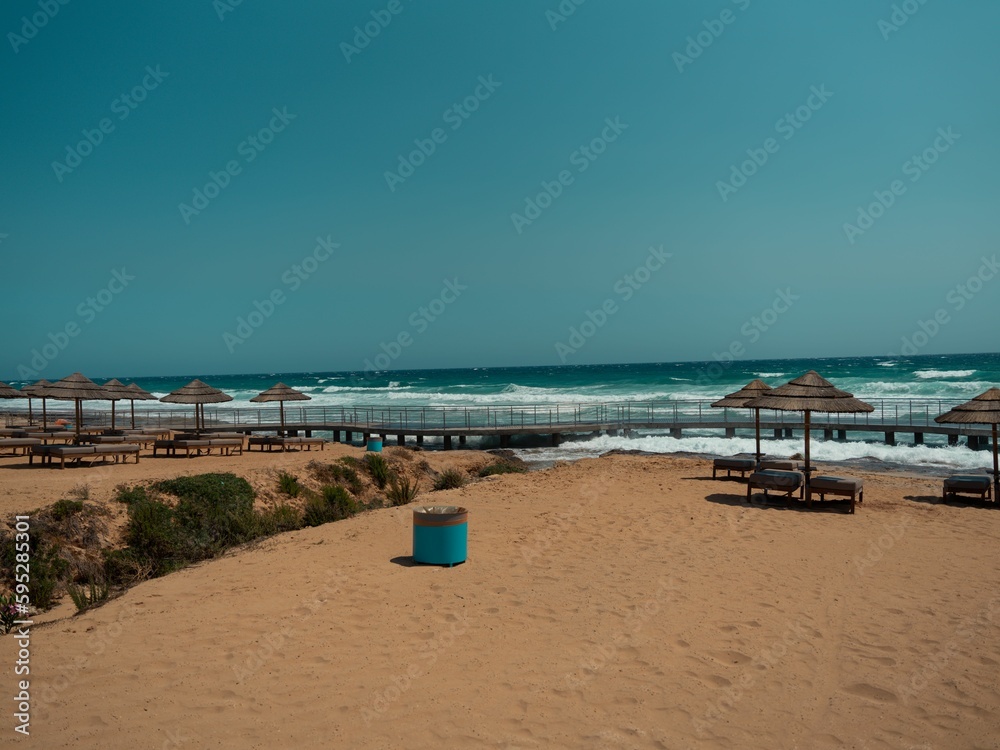 Beautiful, pristine beach with white, powdery sand and clear, azure sky in the background Beautiful, pristine beach with white, powdery sand and clear, azure sky in the background