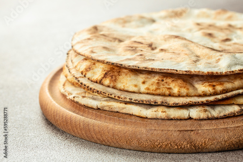 Homemade wheat tortillas, pita bread, tortilla, pita. Traditional Arabic cuisine. banner, menu, recipe place for text, top view