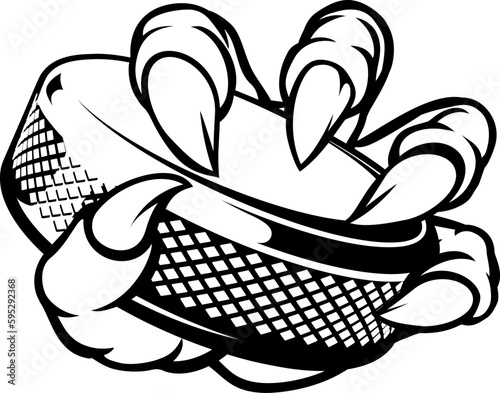 A monster claw or hand holding an ice hockey puck in its talons