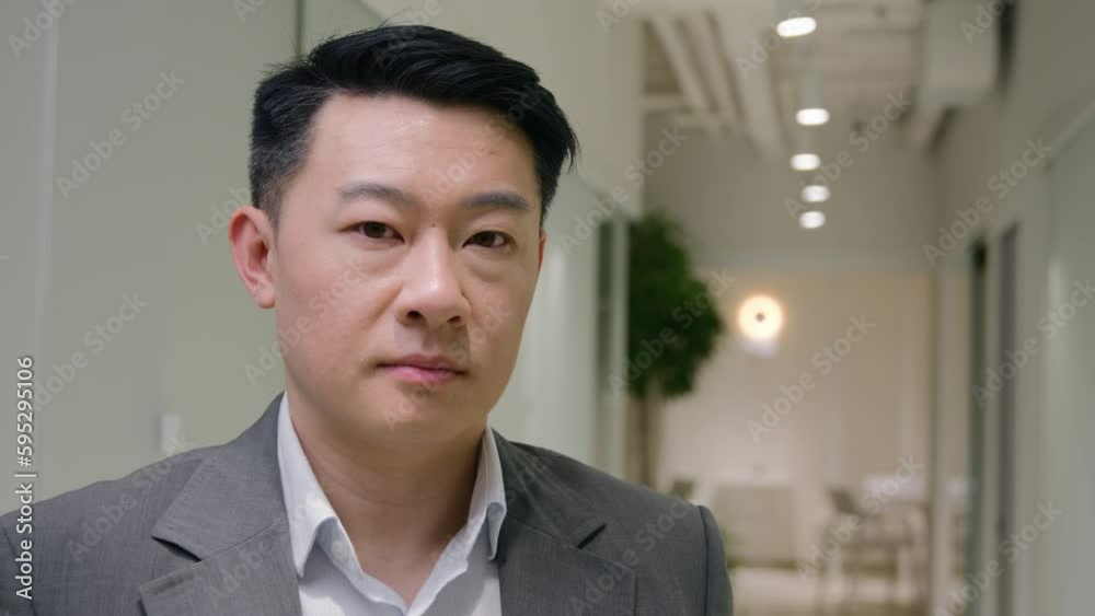 Portrait Asian businessman serious middle-aged ethnic man entrepreneur in office company male mature corporate agent employer looking at camera executive manager business ceo worker lawyer in hallway Portrait Asian businessman serious middle-aged ethnic man entrepreneur in office company male mature corporate agent employer looking at camera executive manager business ceo worker lawyer in hallway